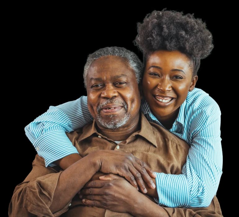 A father and his adult daughter smiling together